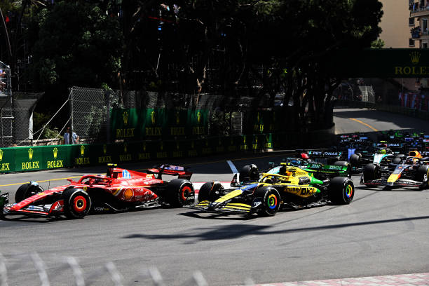 MONTE CARLO, MONACO - MAY 26: Carlos Sainz, Ferrari SF-24, leads Lando Norris, McLaren MCL38, George Russell, Mercedes F1 W15, Max Verstappen, Red Bull Racing RB20, and the remainder of the field at the start during the F1 Grand Prix of Monaco at Circuit de Monaco on May 26, 2024 in Monte Carlo, Monaco.