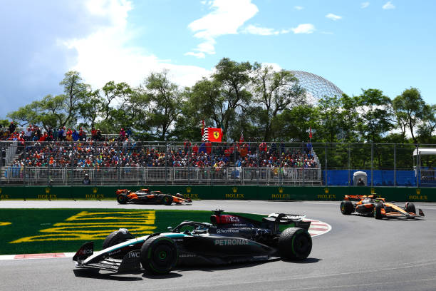 MONTREAL, QUEBEC - JUNE 09: George Russell of Great Britain driving the (63) Mercedes AMG Petronas F1 Team W15 leads Lando Norris of Great Britain driving the (4) McLaren MCL38 Mercedes on track during the F1 Grand Prix of Canada at Circuit Gilles Villeneuve on June 09, 2024 in Montreal, Quebec.