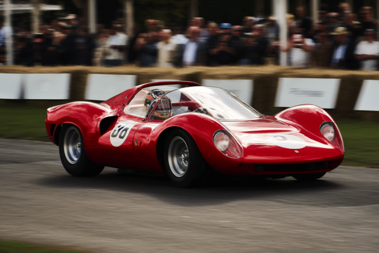 Vintage Ferrari Dino 206S racing at the 2025 Goodwood Members’ Meeting with a crowd in the background, driven by Frank Stippler during his legendary Gurney Cup victory.